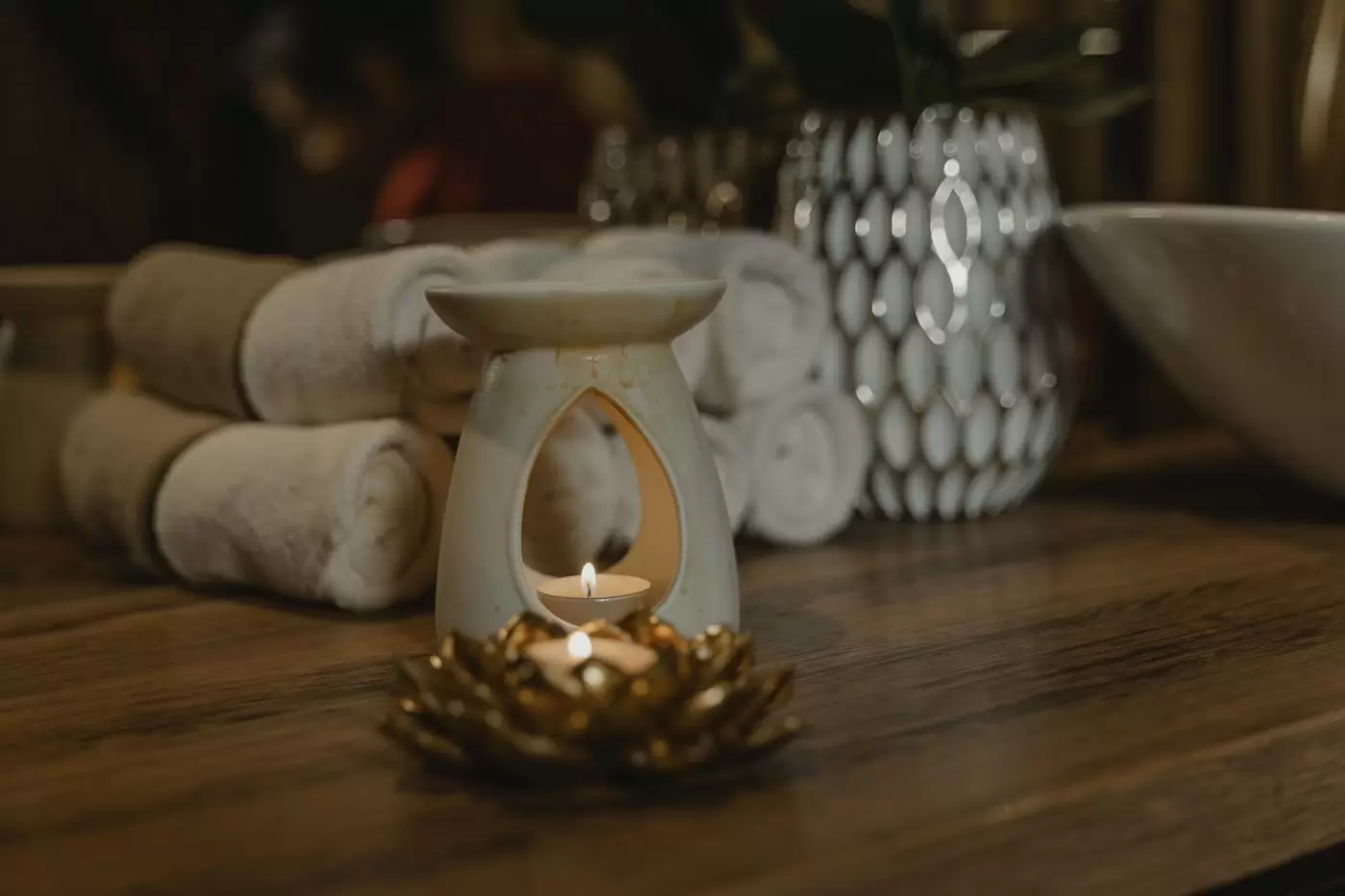 Candle and plush towels in a Da Nang massage spa
