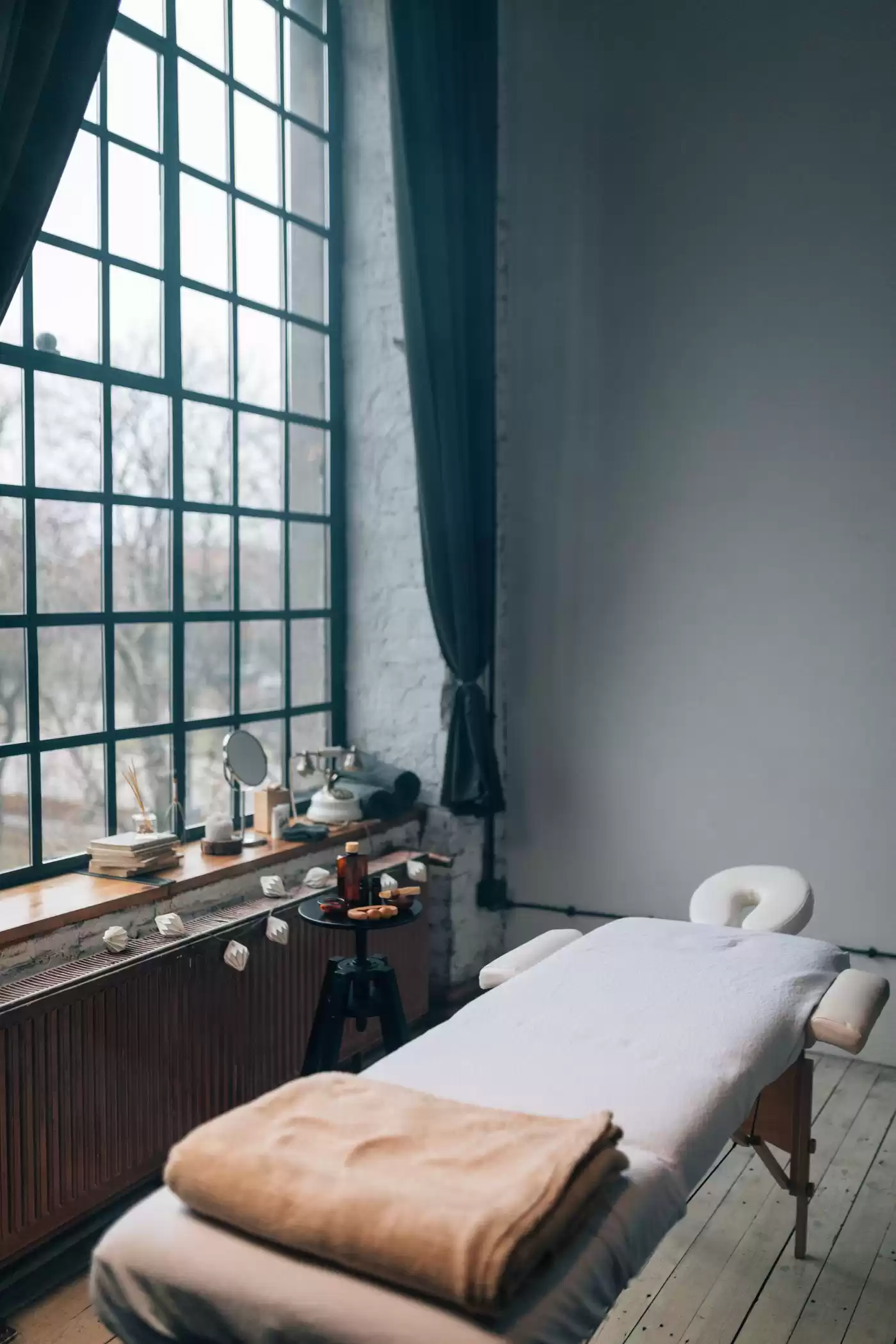 Bright massage room with large windows in Da Nang