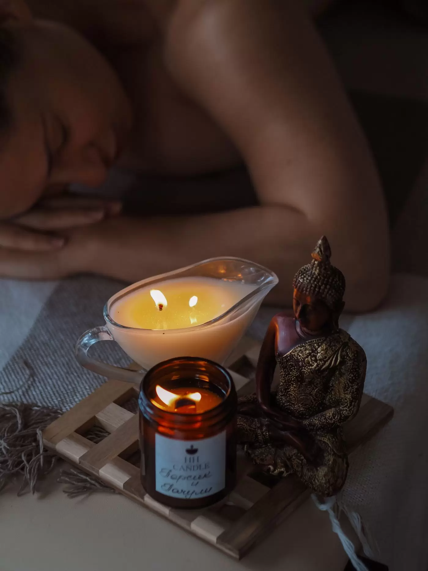 Spa candles and Buddha statue for relaxing massage